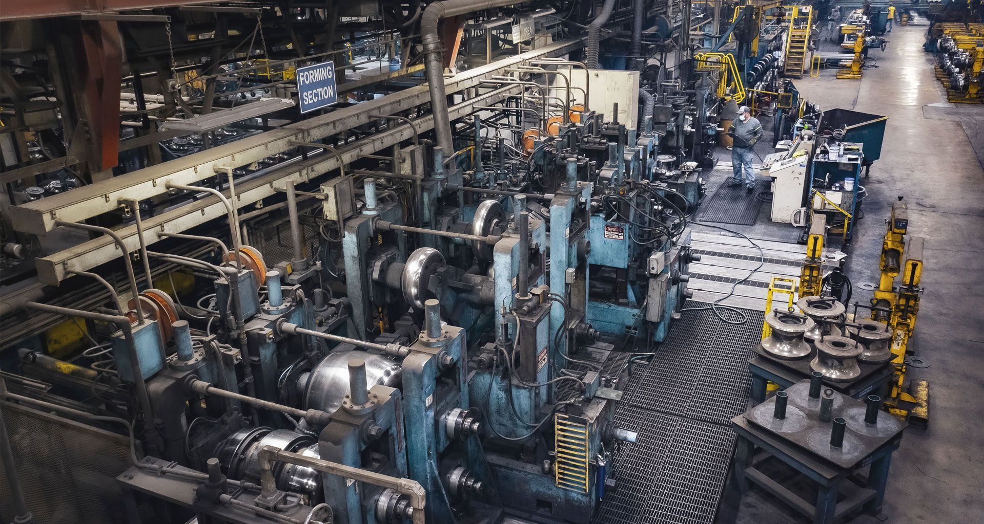 Factory interior with industrial machinery and equipment.